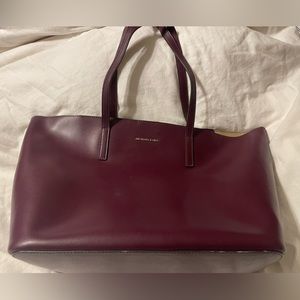 Michael Kors maroon shoulder bag.